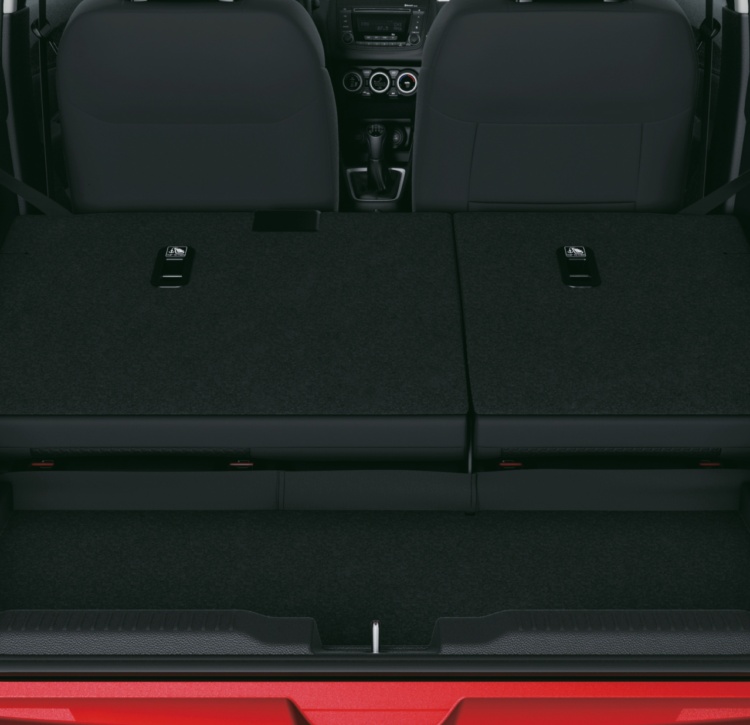 Boot interior of Suzuki Swift showing rear seats folded to create generous load space