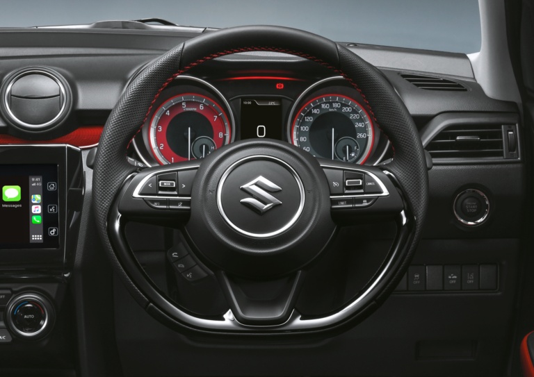 Swift Sport steering wheel with red trim on dash