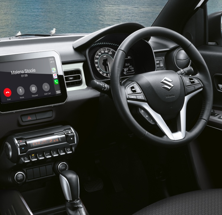 Suzuki Ignis modern interior and dash featuring large touchscreen with smartphone connectivity through Apple CarPlay and Android Auto